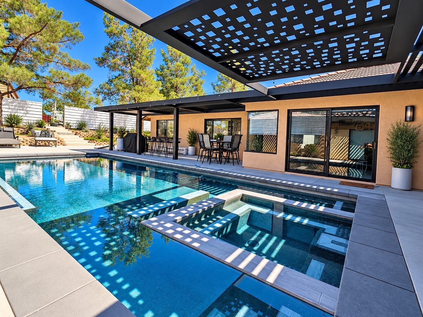 Black attached cover with Square design Soleil panels casting square shadows on a pool