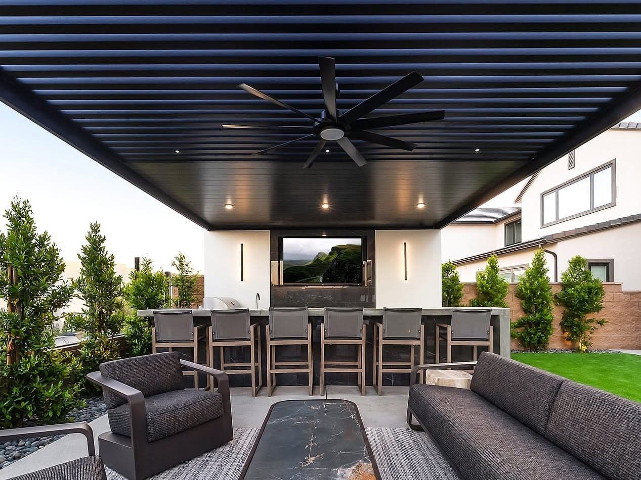 Attached combo cover with lattices and black VEER panels over an outdoor lounge and bar