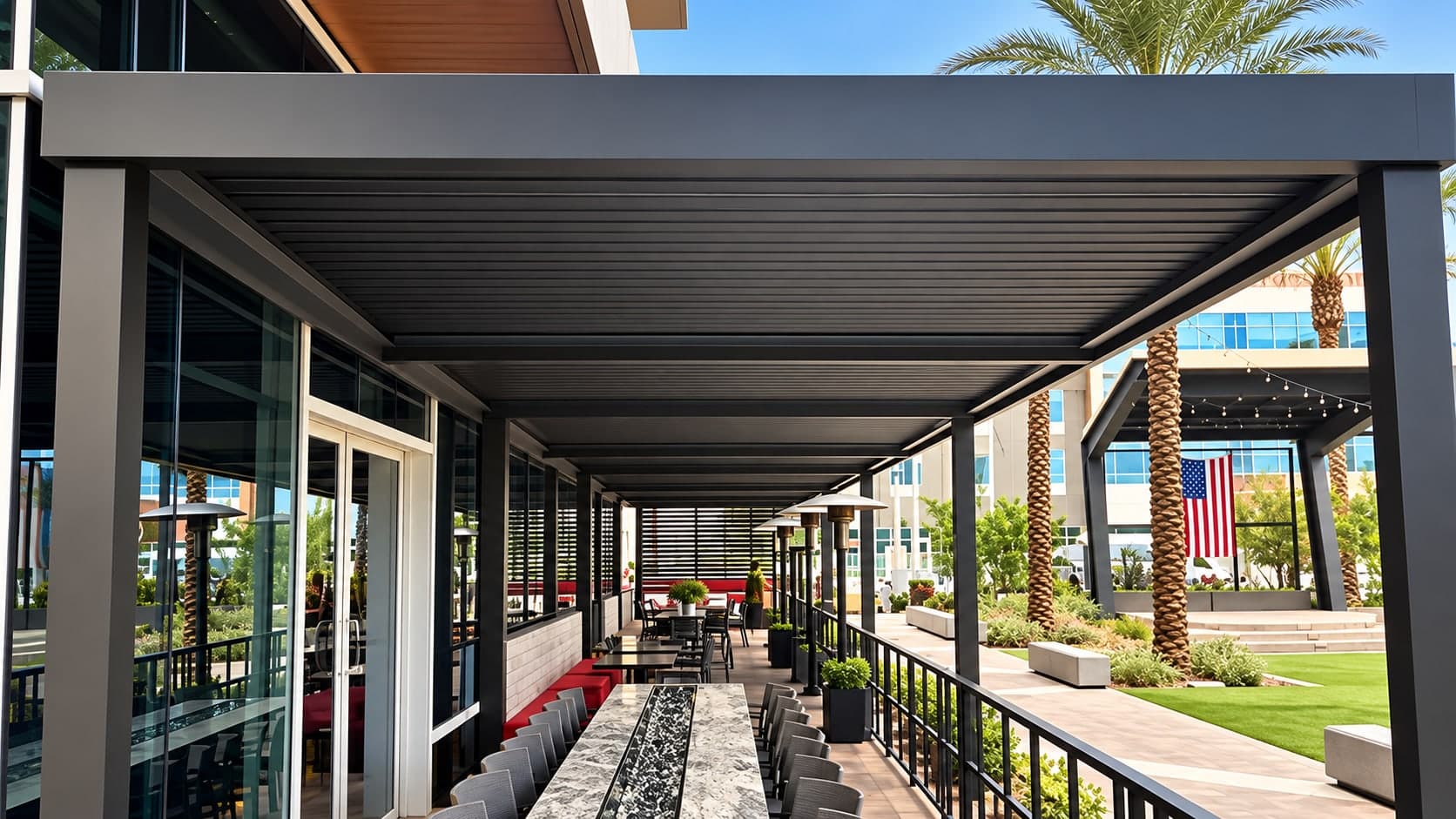 Espresso ATLAS louvered roof over patio dining beside the glass front of DC Steak House, with palm trees and lawn