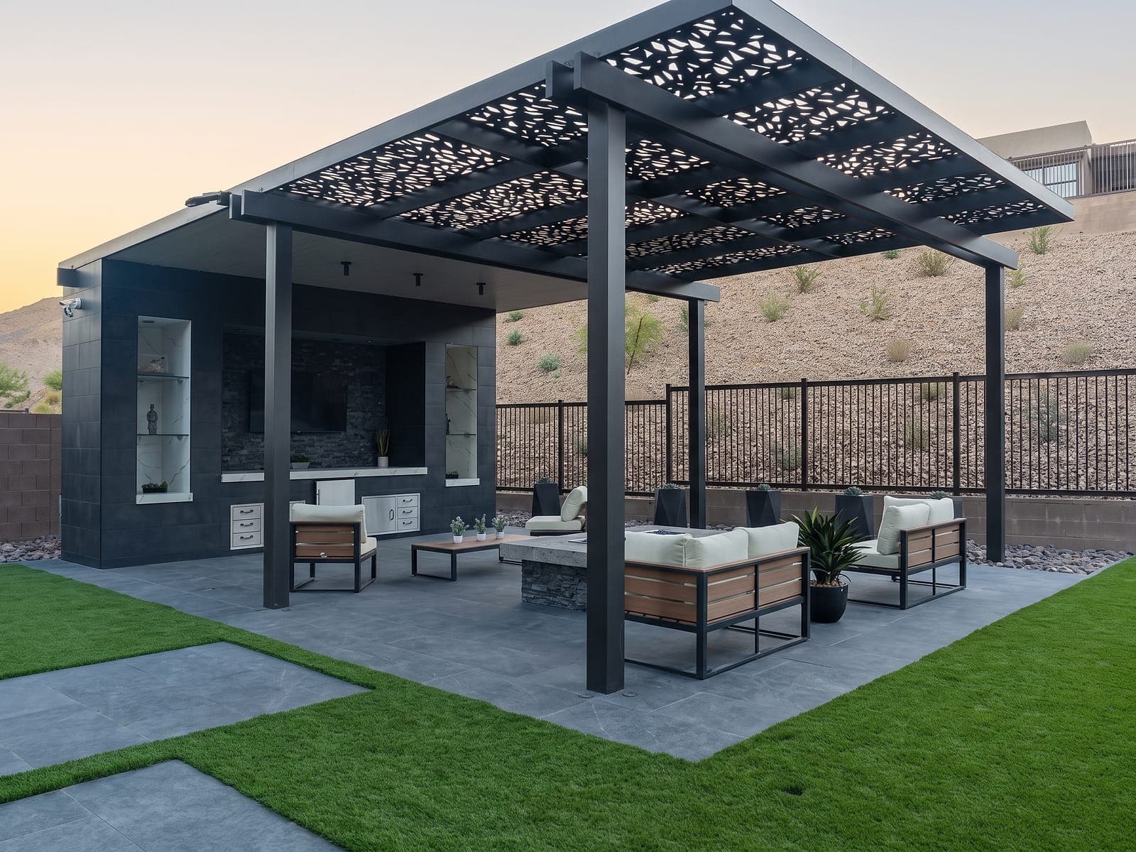 Espresso Beams design Soleil panel roof over an outdoor lounge at dusk