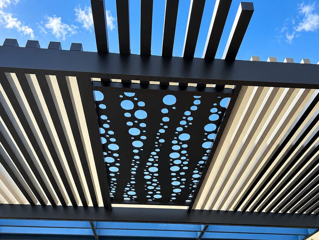 Espresso Bubble design Soleil panel set into a louvered roof, seen from below