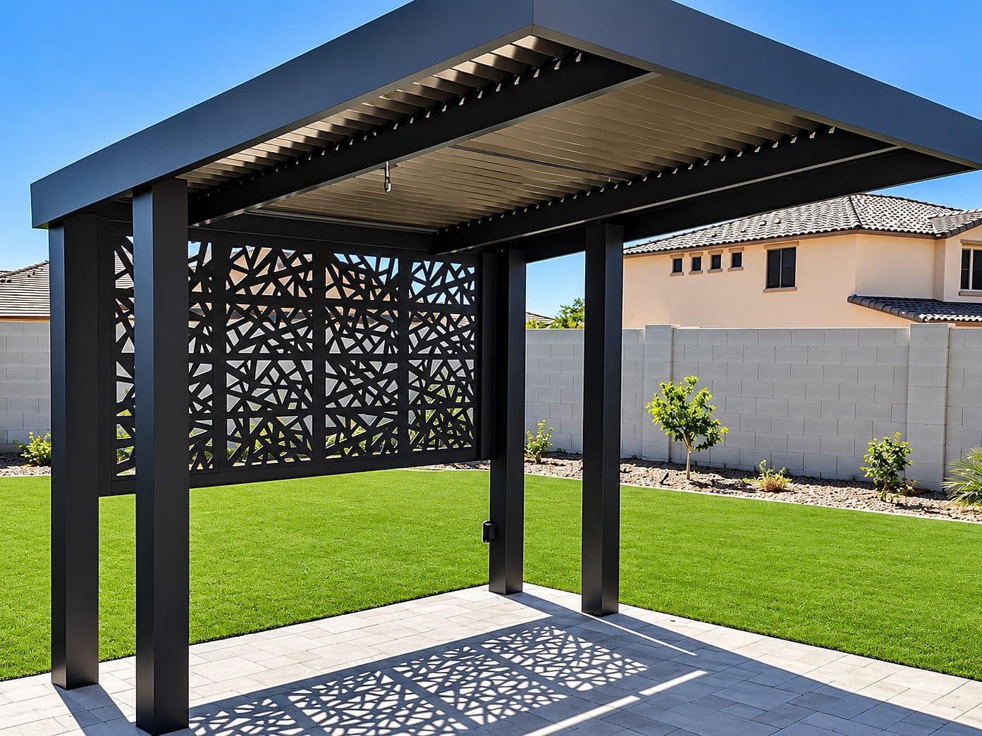 Espresso cantilever with a K Design Soleil panel wall casting its pattern in shadow on the patio