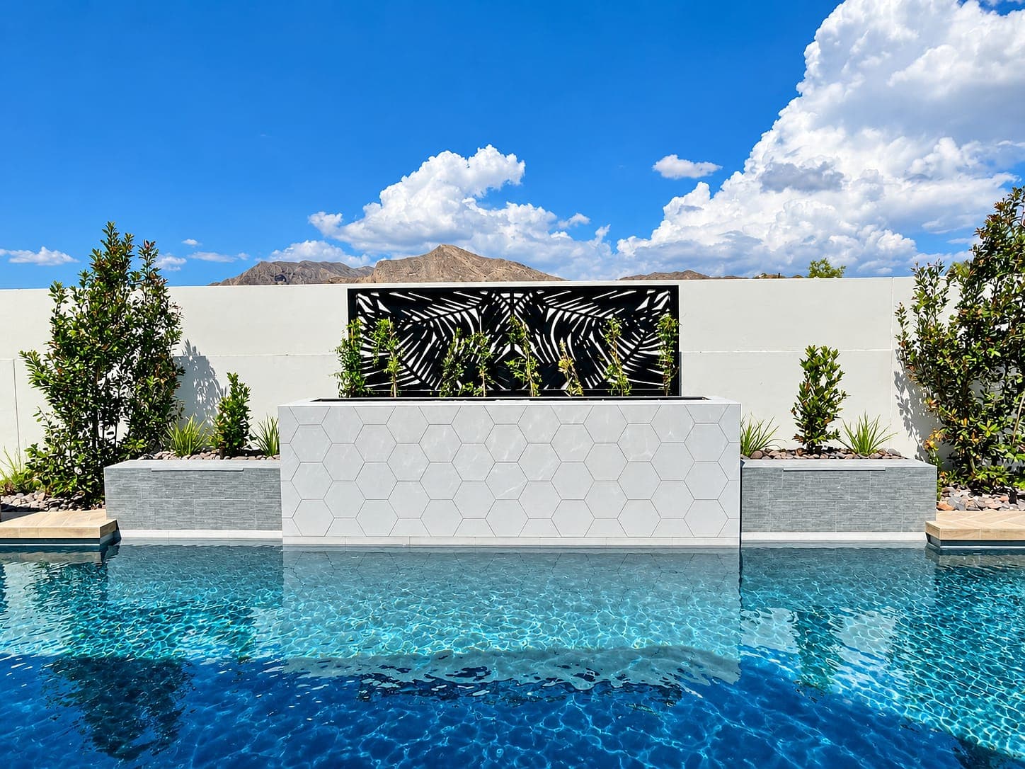 Espresso Palm Jungle Soleil panel as an accent piece behind a pool