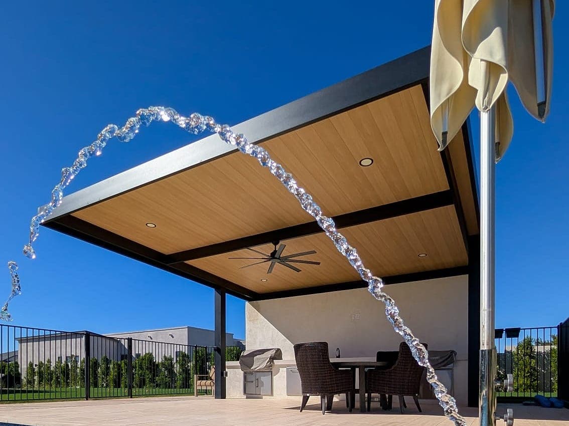Cantilever cover with Sandalwood VEER-Smooth panels beside a pool