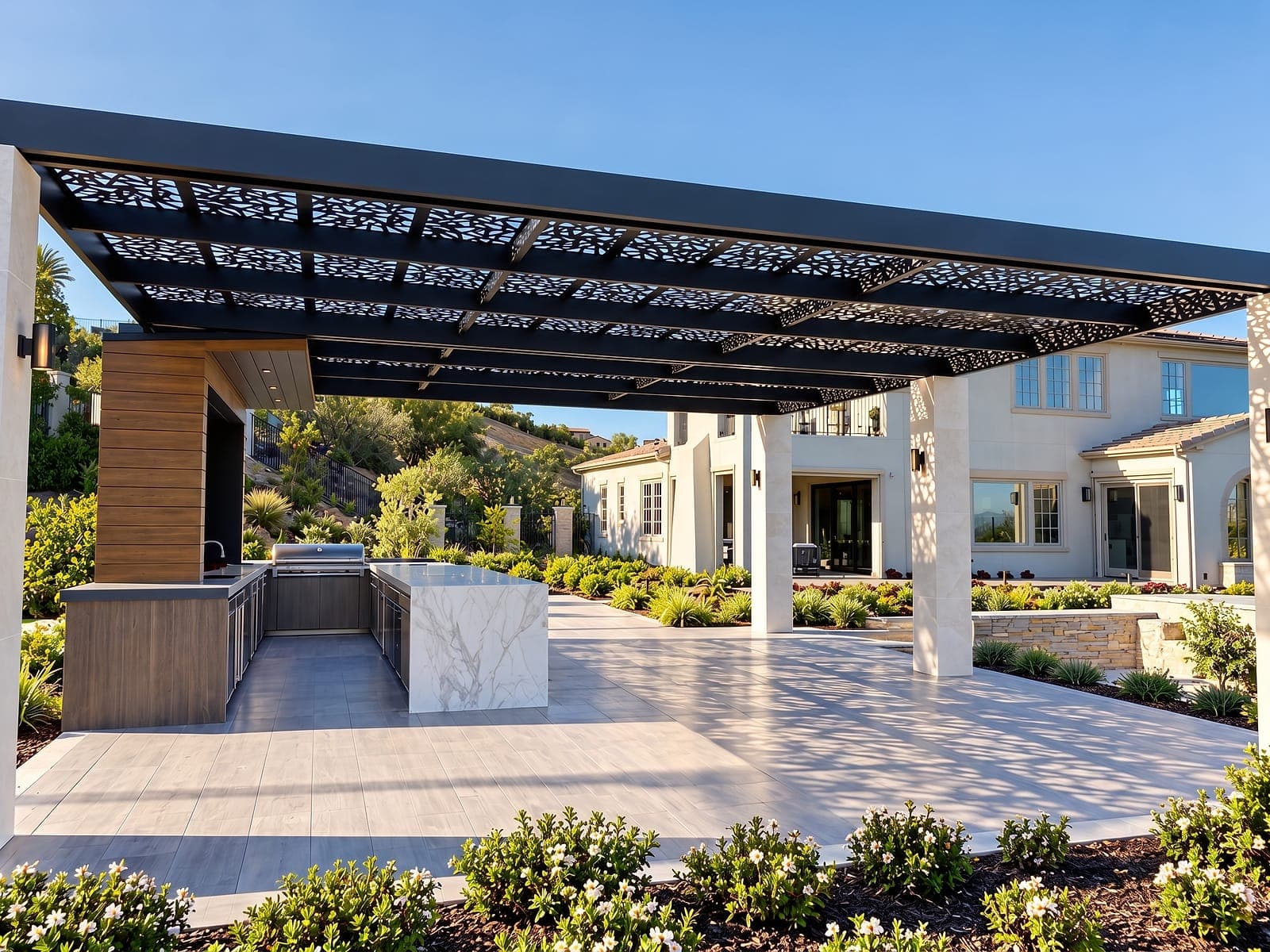 Freestanding pergola with laser-cut Soleil panels over an outdoor kitchen